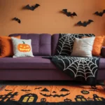 A photo of a cozy Halloween themed living room with a throw, rug, and pillows on the sofa. The room has a purple sofa with orange and white pillows.