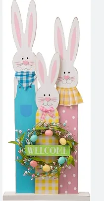 Colorful wooden Easter bunnies with a welcome sign and decorative wreath, perfect for spring home decor and holiday celebrations.