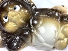 Pottery Tanuki Reclining Japanese Badger Dog As It Waits for Good Luck