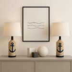 Stylish coastal decor featuring two anchor-themed lamps on a modern console table, complemented by abstract wall art and decorative geometric shapes.