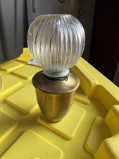 An Edwardian brass and ribbed glass oil lamp.