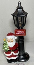 Mr. Christmas 10" Lighted Lamp Post Santa Clause Holding A Christmas Tree 10”