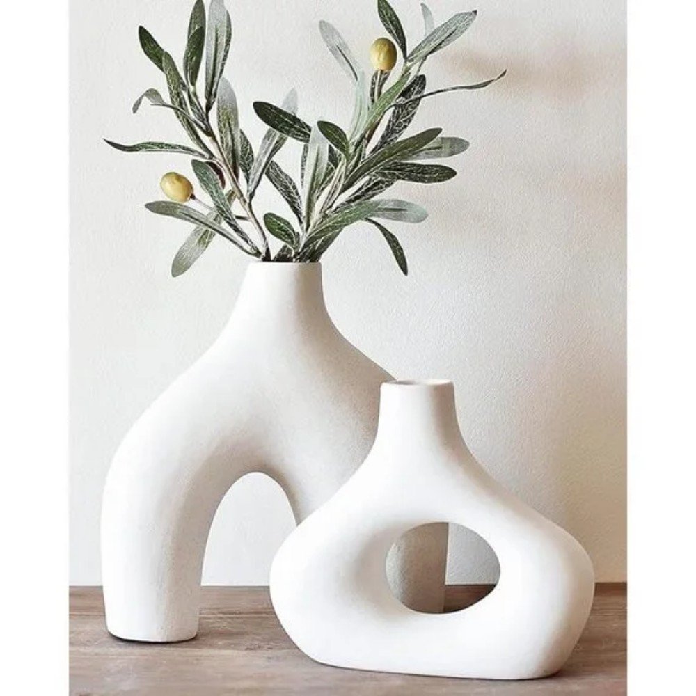 Two modern white vases with olive branches, showcasing minimalist design and elegant home decor for stylish interiors. Perfect for enhancing any living space.
