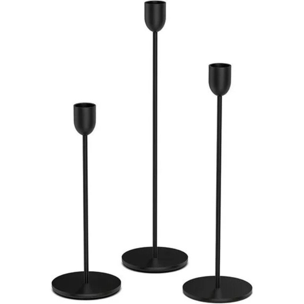 Three modern black candle holders in varying heights, perfect for adding a stylish touch to home decor and creating a cozy atmosphere.
