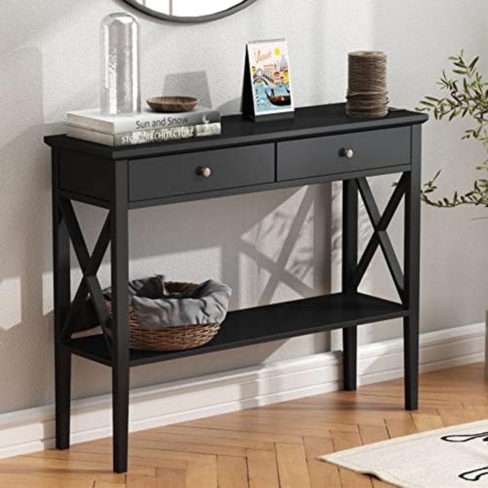 Modern black console table with two drawers, decorative items, and a woven basket, ideal for entryways or living rooms, enhancing home decor and organization.