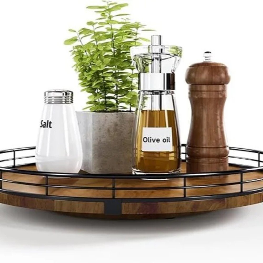Stylish kitchen centerpiece featuring salt, olive oil, pepper grinder, and a small potted plant on a wooden tray. Perfect for home decor.