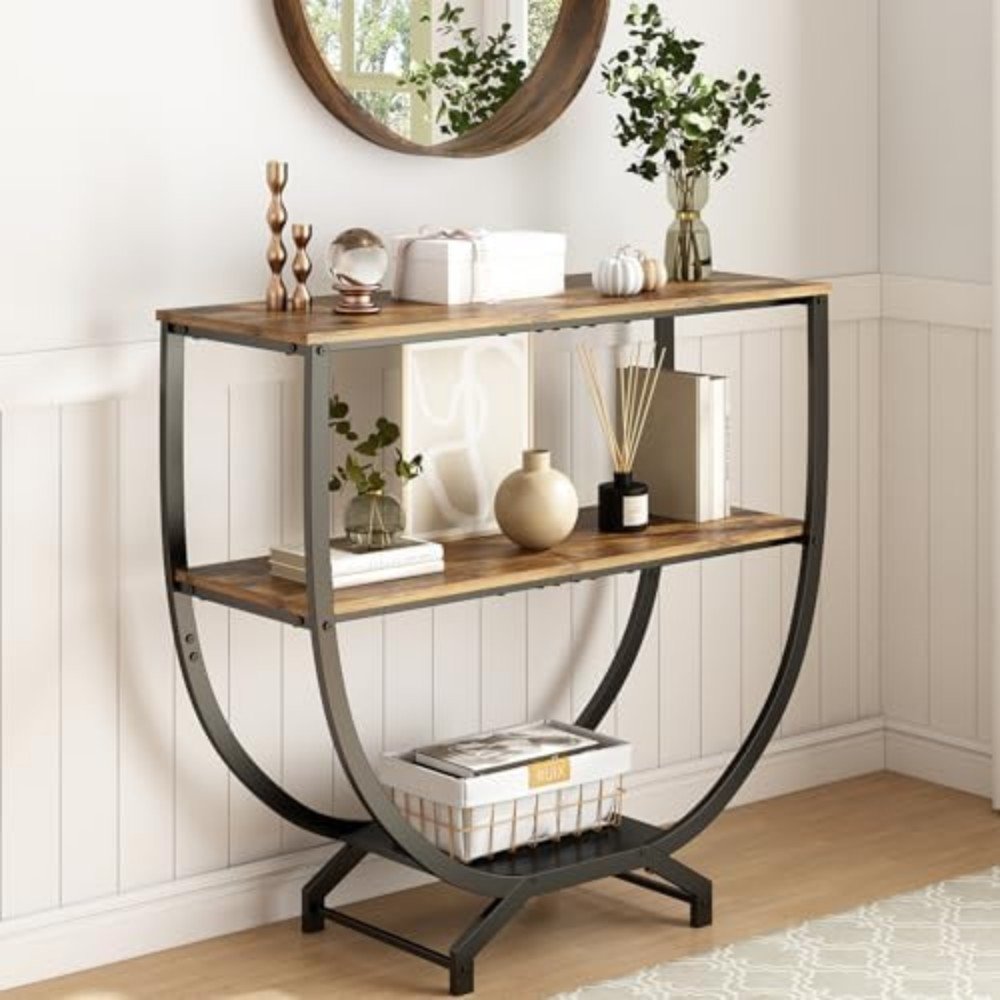 Stylish console table with wooden shelves and metal frame, featuring decorative items and plants, perfect for modern home decor.