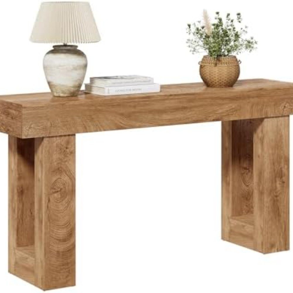 Stylish wooden console table featuring a decorative lamp, books, and a potted plant, perfect for enhancing modern home decor.