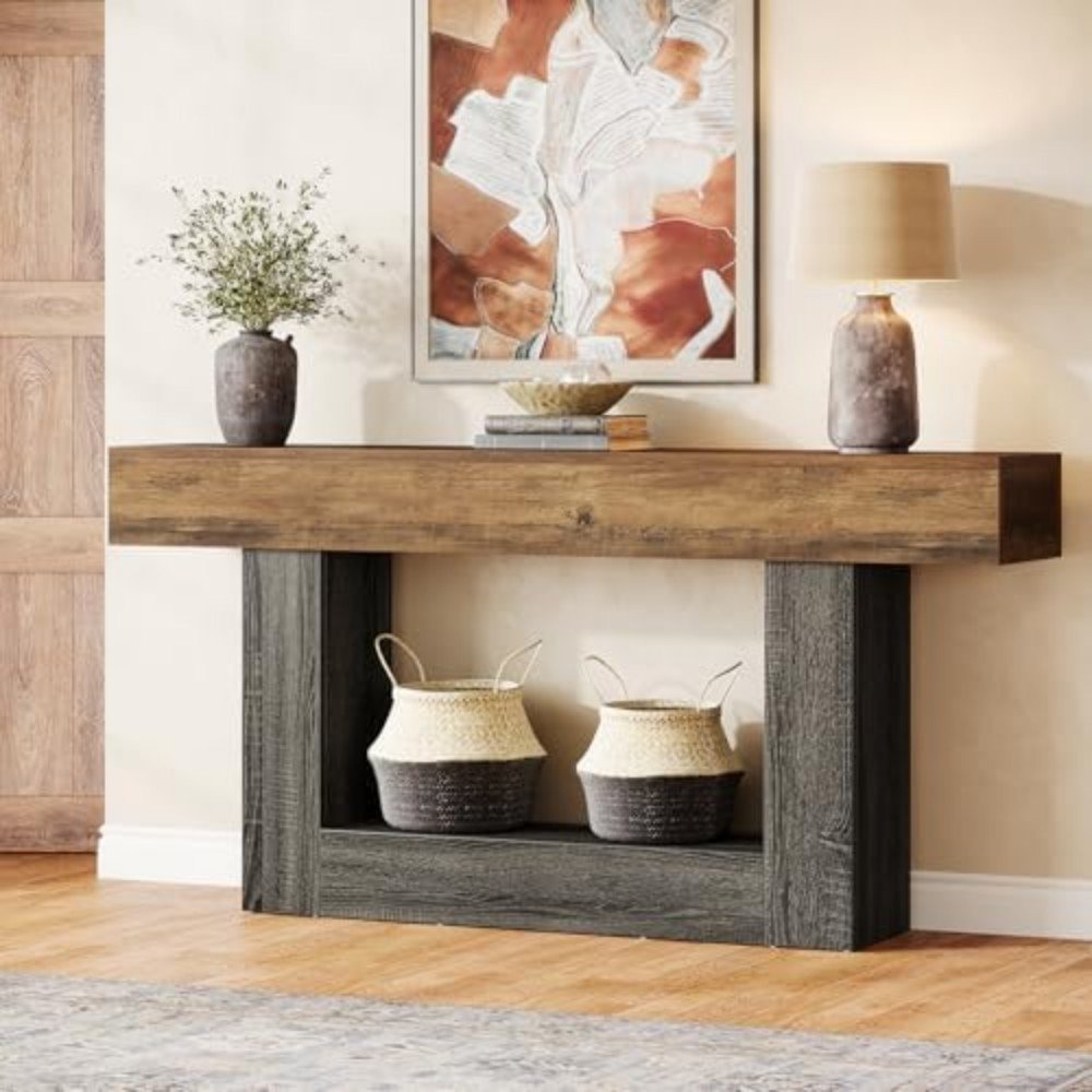 Wooden console table with decorative vases and baskets, featuring a modern wall art piece in a stylish interior setting. Ideal for home decor inspiration.