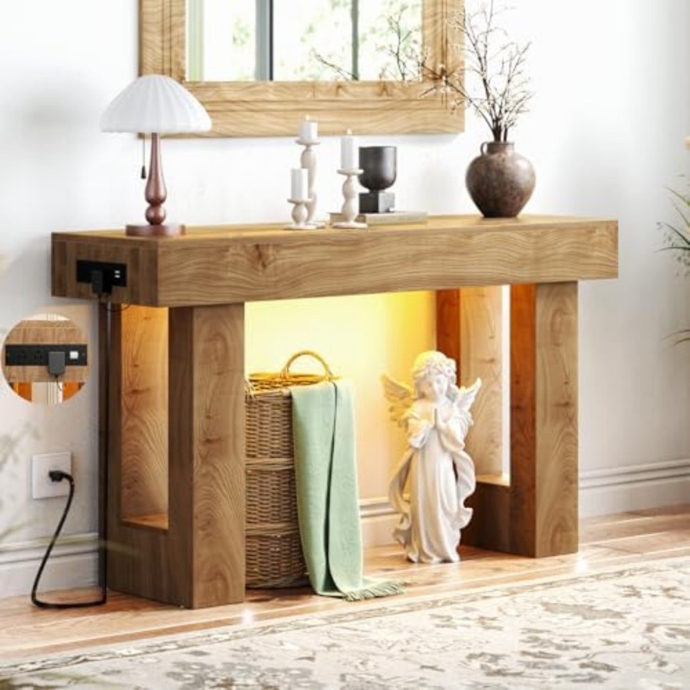 Stylish wooden console table with integrated lighting, decorative items, and a cozy atmosphere, perfect for enhancing living room decor.