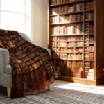 Cozy reading nook featuring a plush chair, a book-themed blanket, a steaming coffee cup, and a wooden bookshelf filled with colorful books.