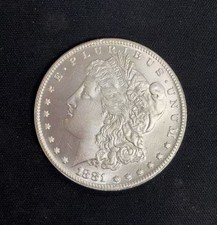1889 Morgan silver dollar, copper coin