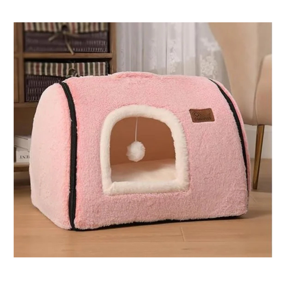 Cozy pink pet house with plush interior, featuring a playful dangling pom-pom, perfect for small cats or dogs seeking comfort and security.
