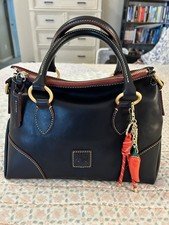 Dooney and Bourke Florentine Satchel 30 in the color Navy. EUC comes w/bag charm
