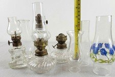 4 Antique Oil lamps and 7 Chimneys See Pics.